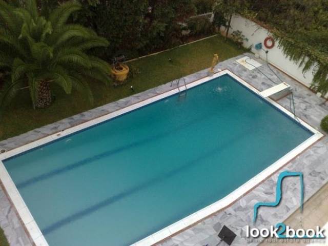 APARTMENT WITH COMMON USE SWIMMING POOL AND GARDEN IN VOULA 