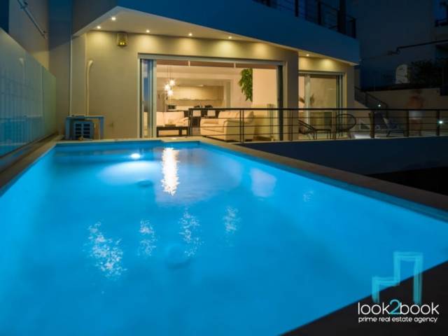 NEWLY BUILT FURNISHED APARTMENT WITH POOL, GARDEN AND UNLIMITED VIEWS IN VOULA 